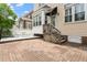 Charming brick backyard featuring a patio area with furniture and a wooden deck at 3928 Bentley Bridge Rd, Raleigh, NC 27612