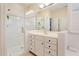 Well-lit bathroom with a glass-enclosed shower and ample vanity space at 3928 Bentley Bridge Rd, Raleigh, NC 27612