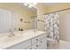 Bathroom with double vanity, a large mirror, and shower-tub combo at 3928 Bentley Bridge Rd, Raleigh, NC 27612