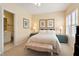 Comfortable bedroom with neutral tones, a ceiling fan, and shuttered windows at 3928 Bentley Bridge Rd, Raleigh, NC 27612