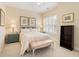 Comfortable bedroom with neutral tones, a ceiling fan, and shuttered windows at 3928 Bentley Bridge Rd, Raleigh, NC 27612