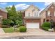 Attractive two-story home featuring a brick facade, attached garage, and well-manicured lawn at 3928 Bentley Bridge Rd, Raleigh, NC 27612