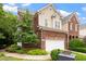 Beautiful two-story home with brick and siding exterior, plus a two-car garage and landscaped yard at 3928 Bentley Bridge Rd, Raleigh, NC 27612