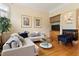 Living room with hardwood floors, built-in cabinets, and fireplace, offering a cozy and stylish space at 3928 Bentley Bridge Rd, Raleigh, NC 27612