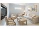 Inviting living room with a cozy fireplace and comfortable seating arrangement at 3928 Bentley Bridge Rd, Raleigh, NC 27612