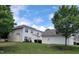 Exterior view of two-story home with well-maintained lawn and mature trees for curb appeal at 4202 Cherry Blossom Cir, Durham, NC 27713