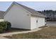 This detached garage features neutral siding and a white door for convenience and storage at 4202 Cherry Blossom Cir, Durham, NC 27713