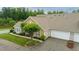 Aerial view of home, showcasing the roof, attached garage, manicured lawn, mature trees and landscaping at 425 Faith Dr, Gibsonville, NC 27249