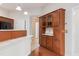 Eat-in kitchen boasts stylish wood cabinets, stainless appliances, and granite counters at 425 Faith Dr, Gibsonville, NC 27249