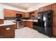 Spacious kitchen features stainless steel appliances, granite countertops and wood cabinets at 425 Faith Dr, Gibsonville, NC 27249