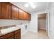 Functional laundry room with cabinets, sink, and washer/dryer hookups at 425 Faith Dr, Gibsonville, NC 27249