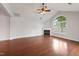 Open living room with vaulted ceiling features a fireplace and hardwood floors at 425 Faith Dr, Gibsonville, NC 27249