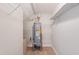 Utility closet with water heater, shelving and tile flooring at 425 Faith Dr, Gibsonville, NC 27249