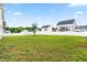 Large, fenced backyard with green grass and patio in a residential neighborhood at 44 Good Morning Ln, Garner, NC 27529