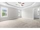 Large bedroom with tray ceiling, ceiling fan and lots of natural light at 44 Good Morning Ln, Garner, NC 27529