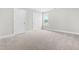 A neutral bedroom featuring plush carpet and natural light at 44 Good Morning Ln, Garner, NC 27529