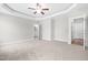 Spacious bedroom with tray ceiling, ceiling fan and adjoins bath at 44 Good Morning Ln, Garner, NC 27529