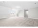 Large bonus room with an abundance of natural light and neutral carpet throughout at 44 Good Morning Ln, Garner, NC 27529
