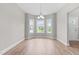 Bright dining space featuring hardwood floors, a bay window, and a chandelier at 44 Good Morning Ln, Garner, NC 27529