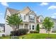 Two-story home with a three-car garage and a well-maintained lawn and landscaping at 44 Good Morning Ln, Garner, NC 27529