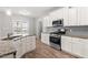 Modern kitchen featuring granite countertops, stainless steel appliances, and ample cabinet space at 44 Good Morning Ln, Garner, NC 27529