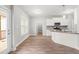 Bright eat-in kitchen with granite countertops, stainless appliances, and door to porch at 44 Good Morning Ln, Garner, NC 27529
