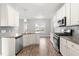 Well-equipped kitchen featuring stainless steel appliances and elegant granite countertops at 44 Good Morning Ln, Garner, NC 27529