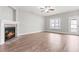 Cozy living room features a fireplace and access to the outdoor patio at 44 Good Morning Ln, Garner, NC 27529