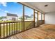 Relax on the screened porch with wooden floors and a view of the community at 44 Good Morning Ln, Garner, NC 27529