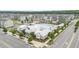 Aerial view of pool, clubhouse, and townhomes on a sunny day at 5910 Giddings St, Raleigh, NC 27616