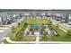 Aerial view of community gardens surrounded by townhomes on a sunny day at 5910 Giddings St, Raleigh, NC 27616