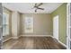 Spacious bedroom with ample natural light, ceiling fan, and neutral paint colors at 5910 Giddings St, Raleigh, NC 27616