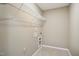 Empty closet with shelving and utility hookups ready for customization at 5910 Giddings St, Raleigh, NC 27616