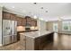 Gourmet kitchen with stainless steel appliances, a large island, and pendant lighting at 5910 Giddings St, Raleigh, NC 27616