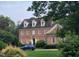 Charming two-story brick home with symmetrical windows and lush landscaping offering excellent curb appeal at 605 Lake Boone Trl, Raleigh, NC 27607