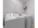 Laundry room with side by side washer and dryer, and overhead shelving at 635 Grace Hodge Dr, Cary, NC 27519