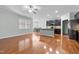 Open floorplan features spacious living area, hardwood floors, and modern kitchen at 635 Grace Hodge Dr, Cary, NC 27519