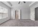 Spacious main bedroom with tray ceiling, neutral walls, and carpet floors at 635 Grace Hodge Dr, Cary, NC 27519