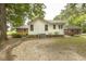 Rear of home showing brick and siding, plus outdoor living and dining spaces at 6517 Whitted Rd, Fuquay Varina, NC 27526