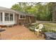 Charming brick patio featuring an array of potted plants and bench seating at 6517 Whitted Rd, Fuquay Varina, NC 27526