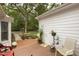 View of a wooden deck and brick patio in the backyard at 6517 Whitted Rd, Fuquay Varina, NC 27526