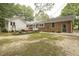 Expansive backyard with a well-maintained lawn, and a cozy patio, perfect for entertaining at 6517 Whitted Rd, Fuquay Varina, NC 27526