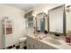 Bathroom featuring a double vanity, checkered flooring, and ample storage space at 6517 Whitted Rd, Fuquay Varina, NC 27526