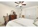 Cozy bedroom features wood dresser, ceiling fan, and two spacious closets at 6517 Whitted Rd, Fuquay Varina, NC 27526