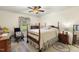 Charming bedroom boasts a four-poster bed, area rugs and lots of natural light at 6517 Whitted Rd, Fuquay Varina, NC 27526