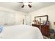 Bright bedroom featuring a bed, dresser with mirror, and double closets provides a comfortable and functional space at 6517 Whitted Rd, Fuquay Varina, NC 27526