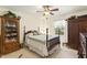 Bedroom with wooden furniture, ceiling fan, and a window with natural light at 6517 Whitted Rd, Fuquay Varina, NC 27526