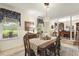 Well-lit dining room with a large window and charming decor at 6517 Whitted Rd, Fuquay Varina, NC 27526