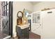 Entryway and mudroom with black double doors, a white door, and a full-sized refrigerator at 6517 Whitted Rd, Fuquay Varina, NC 27526