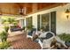 Cozy covered front porch with comfortable seating, perfect for relaxing outdoors at 6517 Whitted Rd, Fuquay Varina, NC 27526